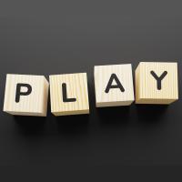 Wood blocks that spell "PLAY"